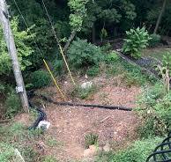 Preventing dirt in sloped drain solutions?