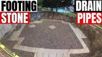 Footing drain pipes and basement stone