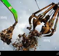 Crane grabber loading metal scrap Stock Photo - Alamy