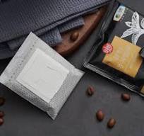 Drip coffee bag packaging machine with outer envelope