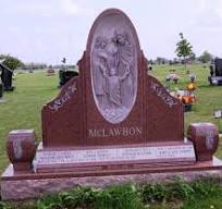 Red granite monument with bas relief of holy family ...