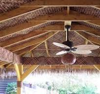 Tiki hut ceiling with matting and palm thatch