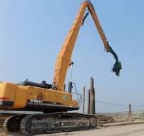 Excavator long boom and arm for sheet pile driving