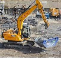 Excavator in scrap metal recycling hi-res stock photography ...
