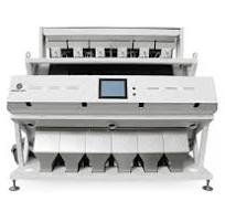 How does a color sorter machine work in food processing?