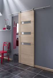 Une Porte Coulissante Avec Rail Haut Visible Cette Porte En Bois Coulisse En Applique Sur Un Rail Apparent Le Sy Porte En Bois Porte Coulissante Sliding Door