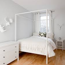 The Brooklyn Home Company Girl S Rooms Bed In Front Of Window White Grommet Drapes Pale Gray Blue Walls Ikea He Canopy Bedroom Home Canopy Over Bed