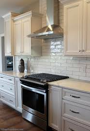 White Kitchen With Long Subway Tile Design And Materials By Village Home Subway Tile Backsplash Kitchen White Subway Tile Kitchen White Tile Kitchen Backsplash