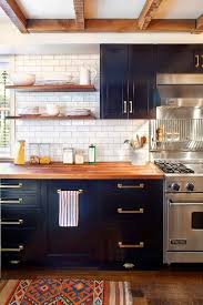 Black And Gold Kitchen Appliances Gorgeous Navy Cabinets With Gold Tone Hardware Next To Stainless Appliances It S Ok Butcher Block Countertops Kitchen Kitchen Inspirations Kitchen Design