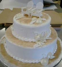 Simple 2 Tier Beach Themed Wedding Cake With Brown Sugar Sand And White Chocolate Seashells Beach Theme Wedding Cakes Beach Wedding Cake Beach Cakes