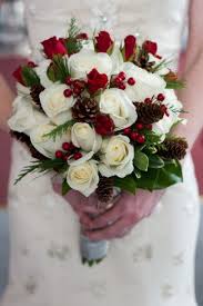 A Merry Christmas Wedding Decor Inspiration White Rose Bouquet With Pine Cones And Pine Christmas Wedding Flowers Winter Wedding Bouquet Christmas Bouquet