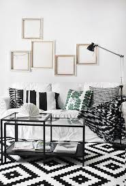 Living Room Ikea Black And White Rug Gallery Walls Are Here To Stay A Thoughtfully Assembled Gallery Wall Is One Of The Best Ways To Add A P Home Decor Decor Black And White Living Room