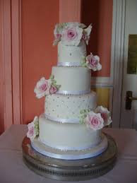 Four Tier Wedding Cake With Edible Lace And Swarovski Crystals Sparkly Cake Sugar Roses In Vin Wedding Cake Maker Wedding Cakes Geode Cake Wedding