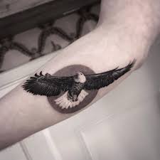 Forearm Bird Of Prey Tattoo Black And Grey Eagle Tattoo On The Left Forearm Eagle Tattoo Hip Tattoo Designs Tattoos