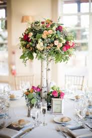 Tall Rustic Wooden Centerpiece With Pink Flowers And Greenery Colorful Organic Chi Tall Wedding Centerpieces Rustic Wedding Centerpieces Wedding Centerpieces