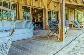 Canape En Lin Terrasse En Bois Hamac Des Vacances Exceptionnelles Dans Cette Cabane Bartherotte Maison Bois Cabane Maison