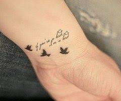 Small Bird And Rose Tattoo Bird Carrying Flower Tattoo Google Search Tattoos Black Bird Tattoo Love Tattoos