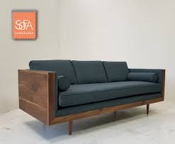 Walnut Pillow Back Sofa Add Some Warmth To Your Living Room With This Walnut Wood Encased Mid Ce Wooden Sofa Designs Living Room Sofa Design Modern Wood Sofa