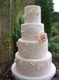 Four Tier Blush Pink Wedding Cake With Hand Piped Lace With Sugar Blossoms Bride And Groom S Names On Garden Wedding Cake Pink Wedding Cake Wedding Cake Maker