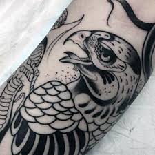 Forearm Bird Of Prey Tattoo Manly Outline Hawk Tattoo On Male Forearm Hawk Tattoo Tattoos For Guys Falcon Tattoo