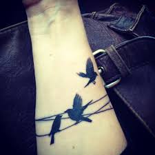 Family Birds On A Wire Tattoo Birds On A Wire Tattoo Bird Tattoo Wrist Cool Tattoos Band Tattoo