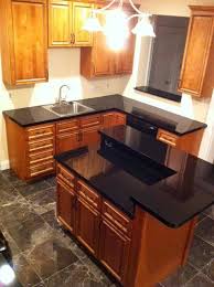 Carriage House Biltmore Cabinets With Night Armour Black Quartz Countertops Designed By Andrea Melkowski Kitchen Design Black Quartz Countertops Home Kitchens