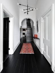 How To Hide Bad Rental Floors Five Ways Black Wood Floors Hallway Decorating House Design
