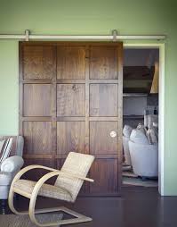 The Oversized Wood Door Panel With The Ragnar Sliding Door Hardware System In This Hawke S Bay Nz Home Allows For An Home House Design Sliding Doors Interior
