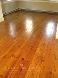 Reclaimed Wide Plank White Pine Barn Wood Flooring We Handcraft Custom Furniture Flooring And One Of A Kind Kitchens Using Farm Table Barn Wood Wood Floors