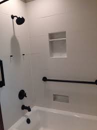 Emsertile Matrix White Textured Tile Delta Trinsic Shower Tub Set Love The Insets In The Shower Wall And T Shower Over Bath White Tile Shower Shower Tile