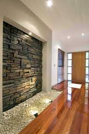 Magnetic Interior Walls Designed With Stones Minimalist Front Room Design With Wooden Floor Decora Stone Wall Design Unique House Design Interior Wall Design