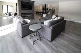 Oak Luxury Vinyl Plank Basement Family Room Flooring And Dark Gray Tile Fireplace Grey Vinyl Flooring Cozy Living Spaces Family Room