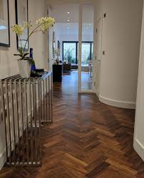 The Staggered Zig Zag Pattern Of The Herringbone Design Leads The Eye From The Hall Into The Adj Herringbone Wood Floor Wood Floor Design Wood Parquet Flooring