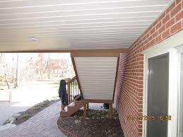 Installing The Sealing Ceiling Vinyl Under Deck Ceiling System On Small Deck Under Deck Ceiling Under Decks Building A Deck