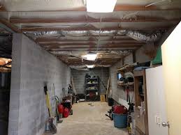 This Basement Garage Had Mice Falling From The Ceiling Now All The Old Insulation Was Removed And Clean Spray Foa Ceiling Basement House Spray Foam Insulation