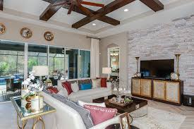Cross Hatch Beams And A Brick Wall Make This Grand Room Unique In Our Starkey Ranch Community In Tampa New Home Home Design New Homes Home Building A House