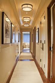 A Great Way To Address Lighting In A Hallway With A Low Ceiling Is To Create Repetition Using A Flush M Hallway Light Fixtures Hallway Lighting Hallway Designs