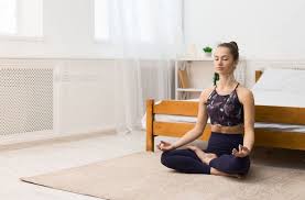 Young Woman Doing Yoga At Home In The Lotus Position By Prostock Studio Young Woman Doing Yoga At Home In The Lotus In 2020 How To Do Yoga Yoga At Home Lotus