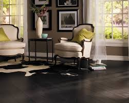 Dark Laminate Flooring In This Black And White Room With A Few Pops Of Color Make A Sophisticated Look Home Black Laminate Flooring Dark Laminate Wood Flooring