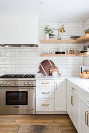 West Coast Style Defined Rue White Subway Tile Backsplash Stainless Steel Appliances White Kitchen New Kitchen Cabinets Kitchen Renovation Kitchen Design