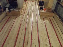 Radiant Floor Heating In A Converted Bus Pex Tubing And Propane Tankless Heater Floor Heater Heated Floors Camper Flooring