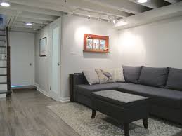 Cozy Chic Basement Reno With Exposed Painted Joists Wood Tile Floors Small Basement Design Small Basement Remodel Basement Ceiling
