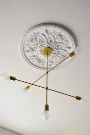 12 Unique Creative Ideas For Ceiling Medallions Knockoffdecor Com Ceiling Medallions Ceiling Rose Modern Chandelier