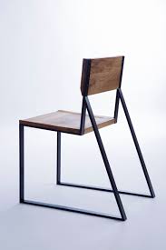 In Profile It Looks To Be A Slender Linear Chair But When Turned You Notice The Shape Made From Solid Steel And Wooden Chair Steel Furniture Furniture Chair