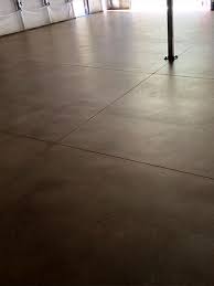 Warm Brown Stained Concrete Warehouse Floor With Matte Finish Topical Sealer Concrete Was Waterproofe Stained Concrete Concrete Stained Floors Warehouse Floor