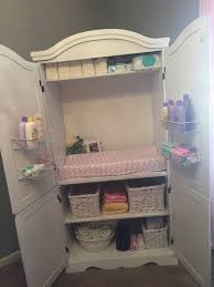 Armoire Repurposed As Changing Table Storage Tiny Room Friendly Baby Armoire Baby Room Organization Baby Storage