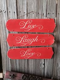 Repurposed Fan Blades Into Super Cute Wall Sign Chalk Painted Coral Distressed Stenciled And Tied Tog Ceiling Fan Crafts Ceiling Fan Blades Ceiling Fan Art