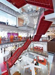 Red Ribbon Staircase Zigzags Through Building Minimal Office Design Corporate Interiors Commercial Design