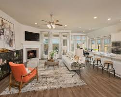 Step Into The Family Room Of Design 2738 By Perry Homes Featuring A Corner Cast Stone Fireplace A Wall Of Windows To Let In Th Model Homes Perry Homes Home