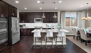 This Palmdale Ca Kitchen Boasts Rich Wood Cabinets And Flooring Beverly Plan By Richmond American New Kitchen Designs Grey Kitchen Walls Dream Kitchen